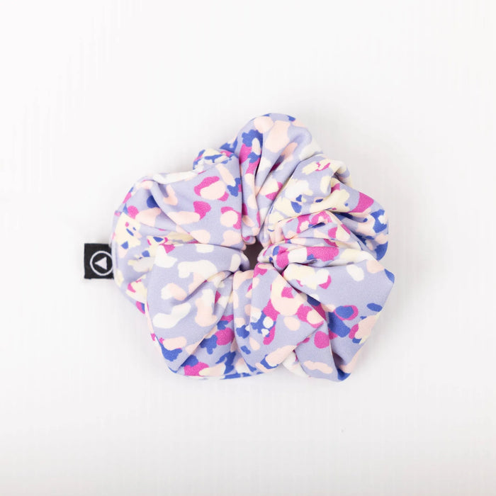 Scrunchie in confetti pattern on a plain white background