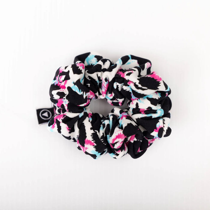 Scrunchie in multi coloured leopard print on a plain white background
