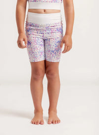 Person wearing Get Moving Confetti patterned bike shorts on a white background