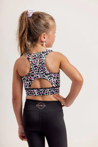 Girl wearing an Envy Me Multi coloured leopard print crop and black Get Moving bike shorts on a white background